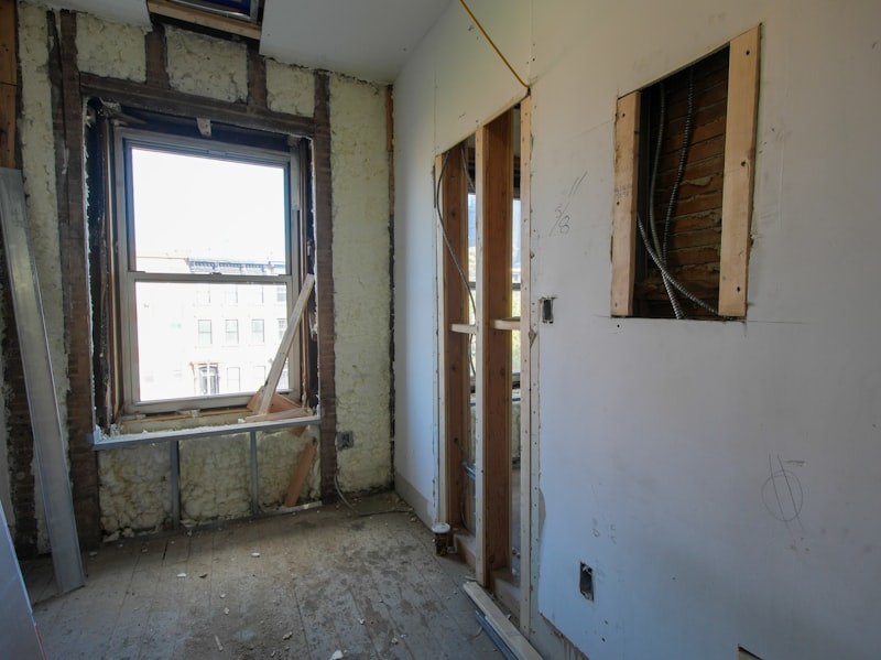 Interior strip-out with exposed walls and debris